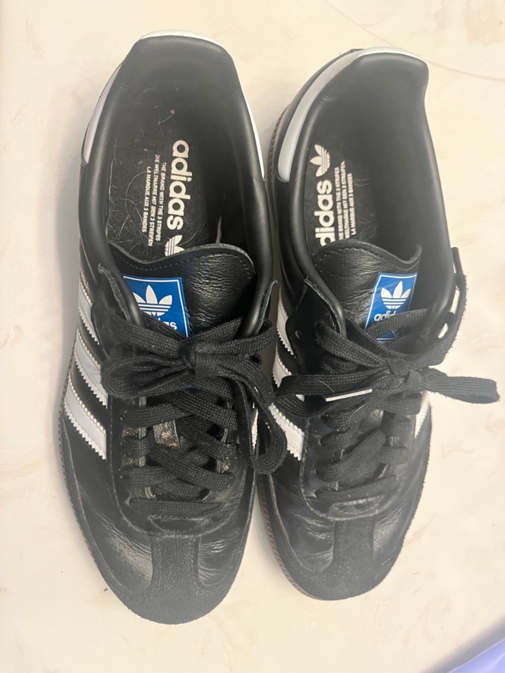 adidas Black Sneakers with White Stripes and Blue Tongue Logo